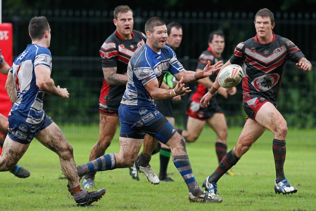 Thirroul's Nathan Wynn moves the ball wide. Picture: CHRISTOPHER CHAN
