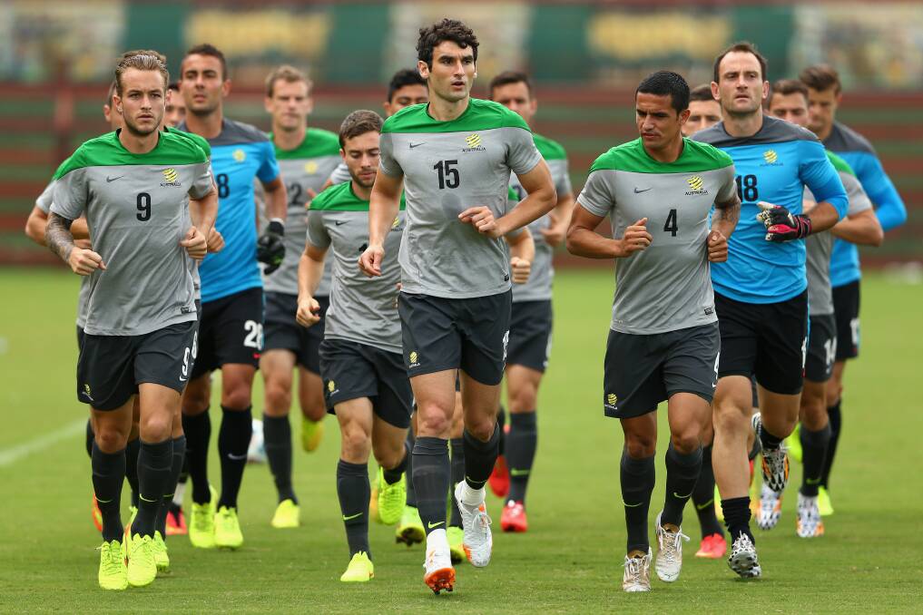 Socceroos captain Mile Jedinak leads team mates in a run during an Australian Socceroos training session at Arena Unimed Sicoob in Vitoria, Brazil.  Picture: GETTY IMAGES