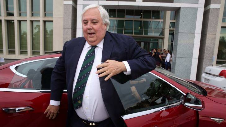 Clive Palmer arrived at Parliament House on Thursday in a Tesla electric car. Photo: Andrew Meares