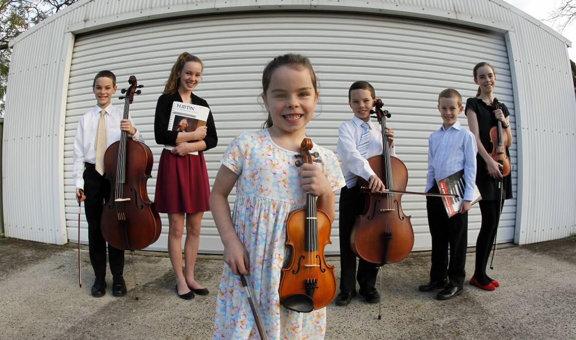 Cormac, 11, cello; Felicity, 15, piano; Celeste, 6, violin, Thomas, 9, cello; Patrick, 8, piano and Isabelle, 13, violin, all competed in this year's Wollongong Eisteddfod. Picture: ANDY ZAKELI