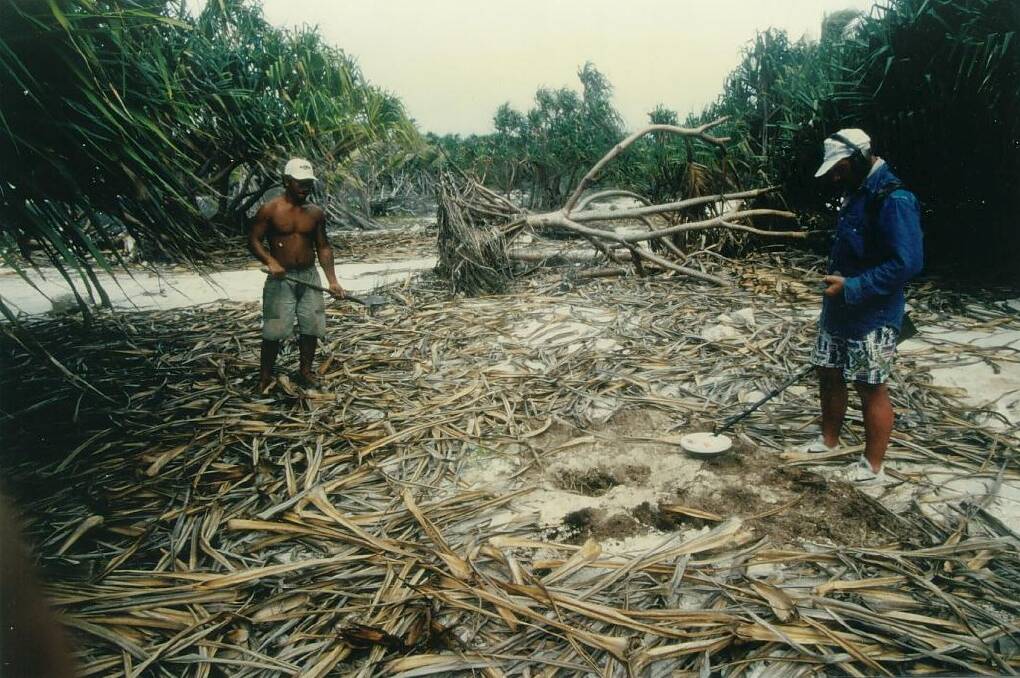Albert Mata (right) with a local labourer searching for the Madagascar on the attol Anuanuraro in 1997. Picture supplied: Gerald Crowley. 