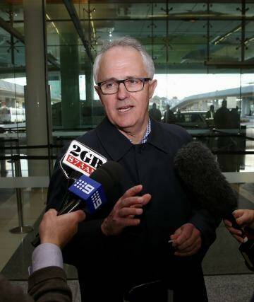 Communications Minister Malcolm Turnbull arrives at Canberra Airport on Sunday.  Photo: Alex Ellinghausen