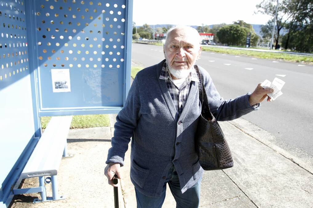 Koonawarra resident Ron Burton buys paper tickets for the bus but the government wants people to use the Opal card. Picture: SYLVIA LIBER