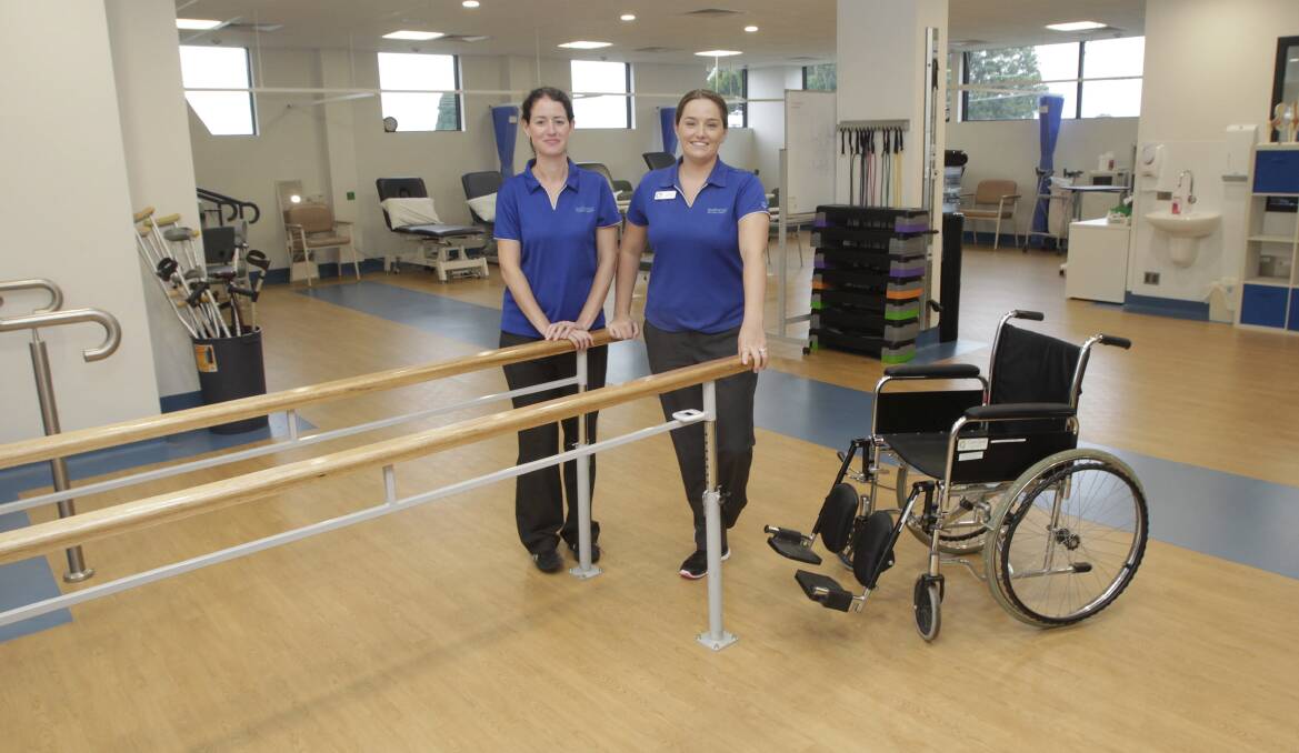 Occupational therapists Nicola Acworth and Jodie Roser in the rehabilitation gymnasium. Picture: ANDY ZAKELI