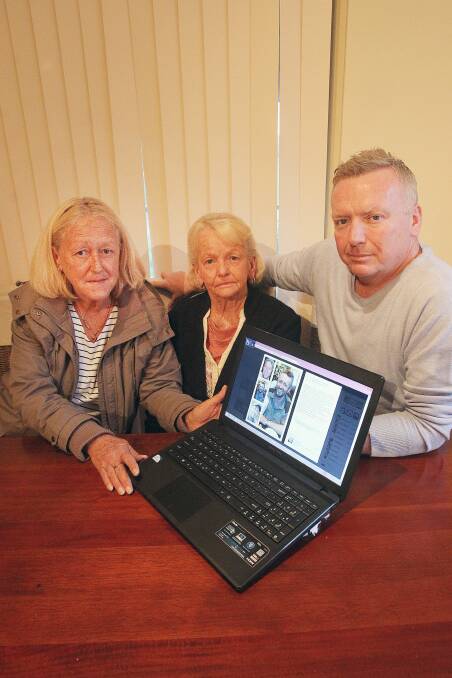 Stoical: Tyronne's mother Margaret White and his cousins Joy and Mark Patek with his picture. Picture: GREG TOTMAN