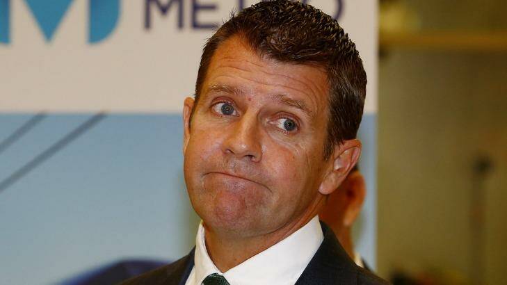 Premier Mike Baird's government will sign off on merger proposals on Thursday. Photo: Daniel Munoz