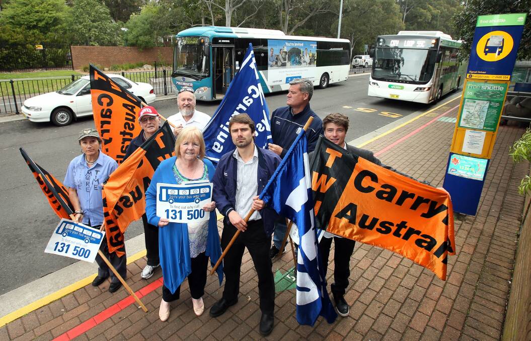 Driven: MP Noreen Hay with Nick McIntosh and protesters at the UOW bus stop. Picture: KIRK GILMOUR