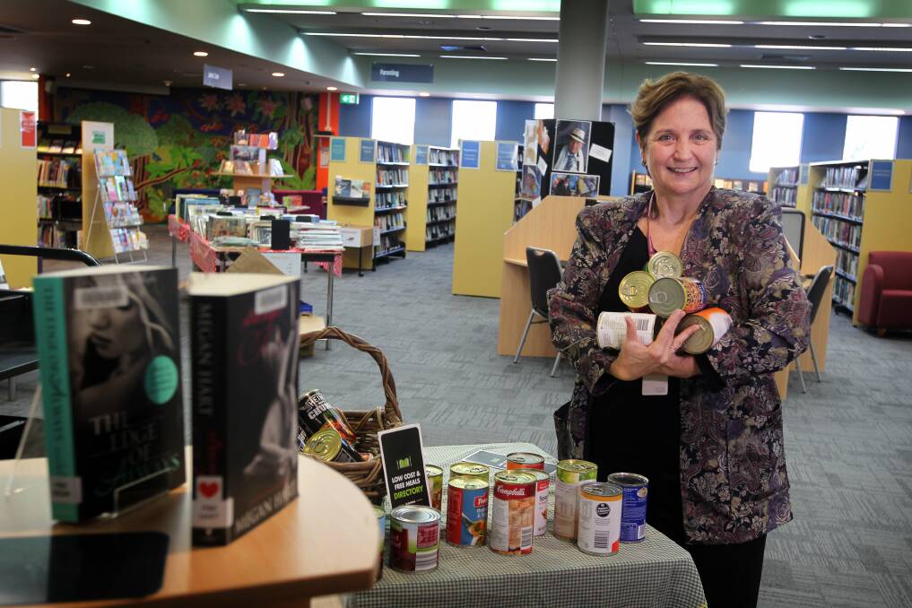 Wollongong City Council library and community services manager Jenny Thompson is encouraging people to take advantage of the Food for Fines amnesty. Picture: SYLVIA LIBER