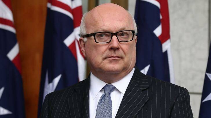 Federal Attorney-General George Brandis has said the Commonwealth will introduce legislation to lower the control order age threshold. Photo: Alex Ellinghausen
