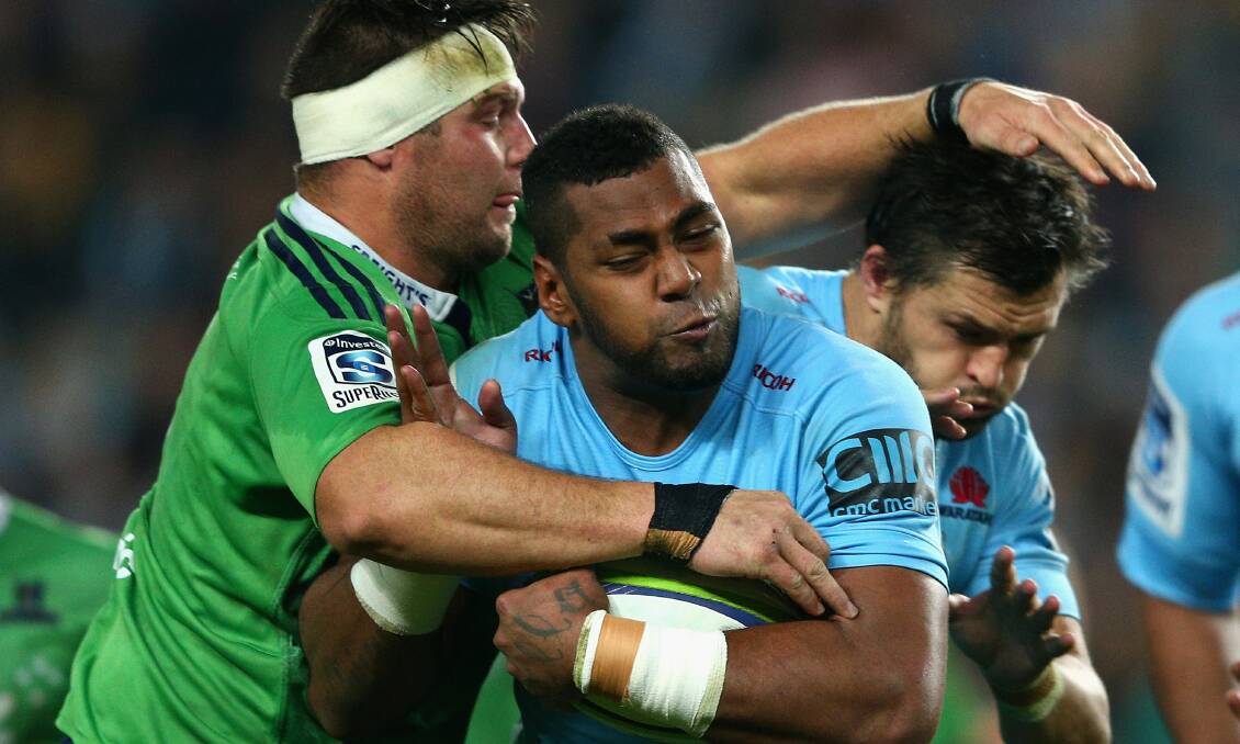 Taqele Naiyaravoro of the Waratahs is shut down by a Highlanders defender during the Super Rugby semi-final at Allianz Stadium on Saturday night. Picture: GETTY IMAGES