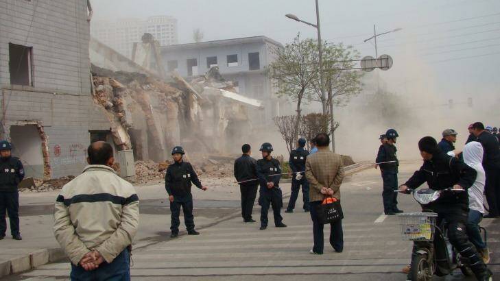 Dozens of security guards prevented Bolang staff from entering as demolition crews razed the four-storey building. Photo: Supplied