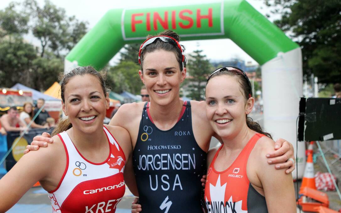Amelie Kretz (third), Gwen Jorgensen (first) and Ellen Pennock (second) after finishing the women's Australia Day Aquathon. Picture: GREG TOTMAN