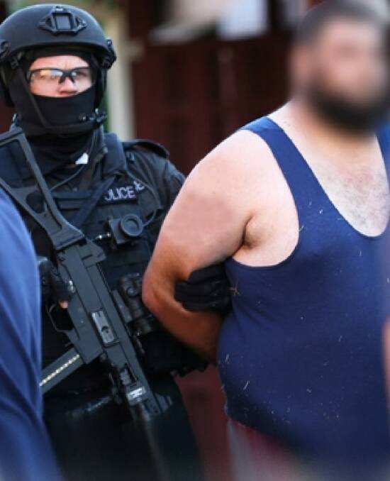 Omar Ammouche is arrested by police.  Photo: Supplied: NSW Police Media