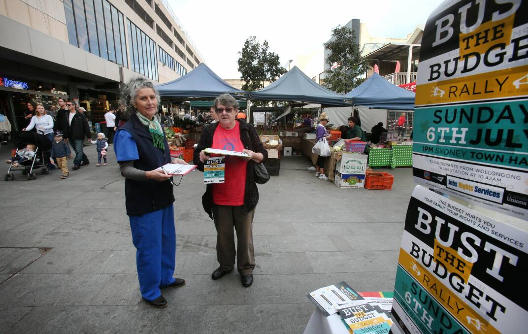 Jane Cooper and Dr Margaret Perrott collect Bust the Budget signatures. Picture: KIRK GILMOUR