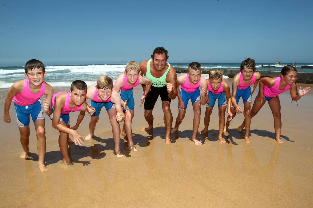 Jason Mercer from Austinmer SLSC with a group of the club's nippers.left to right Callum Rann, Max Ottoway, Liam Empson, Ryan Empson,Jason Mercer, LucasOttoway, Oscar Coltman Harrison Mercer and Ava Coltman.  Picture: GREG TOTMAN