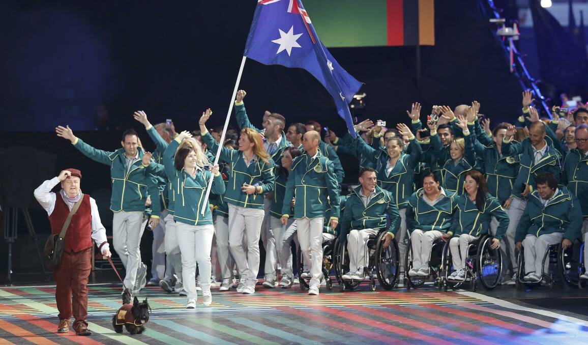 Flag bearer Anna Meares leads the Australian team in the Commonwealth Games opening ceremony at Glasgow. Picture: REUTERS