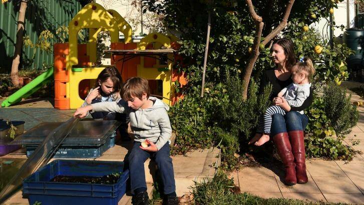 Elizabeth Slakey with her children (from left) Luca, 8, Declan, 5, and Pippi, 2: Valuations for the family's Haberfield home differ by nearly $350,000. Photo: Kate Geraghty