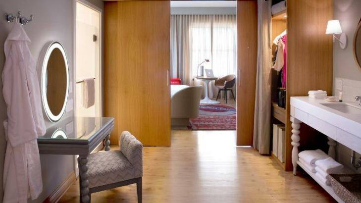 More bells and whistles: A guest suite, which is separated into two rooms with a sliding door. 