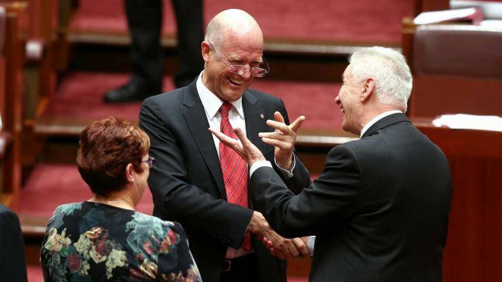 Senator David Leyonhjelm is congratulated by Senator Doug Cameron after delivering his first speech in the Senate last week. Photo: Alex Ellinghausen