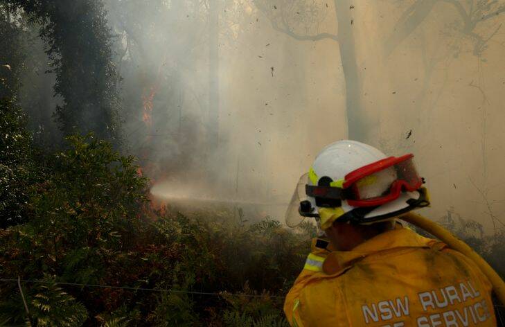 Masonite Rd Tomago bushfire. Pic shows firefighting at Kane & Rhianna Gorfine's house on Cabbage Tree Rd. Picture: Max Mason-Hubers MMH