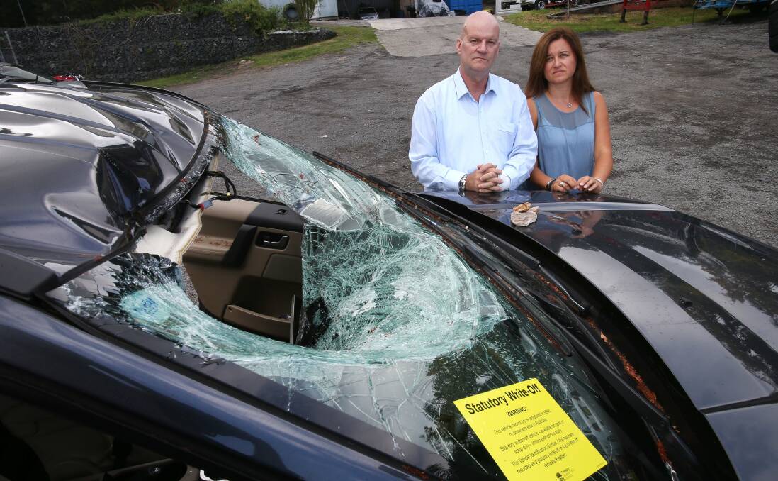 Shocker: Colin Bird with partner Suzanne Latham had a narrow escape, but Colin was badly injured when a 30cm rock fell off the escarpment on Bulli Pass and onto their Land Rover. Picture: KIRK GILMOUR