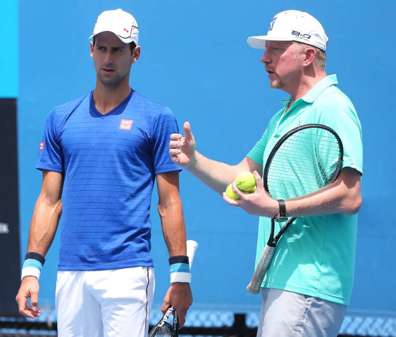 On target: Novak Djokovic and his coach Boris Becker talk tactics during a training session. Picture: GETTY IMAGES
