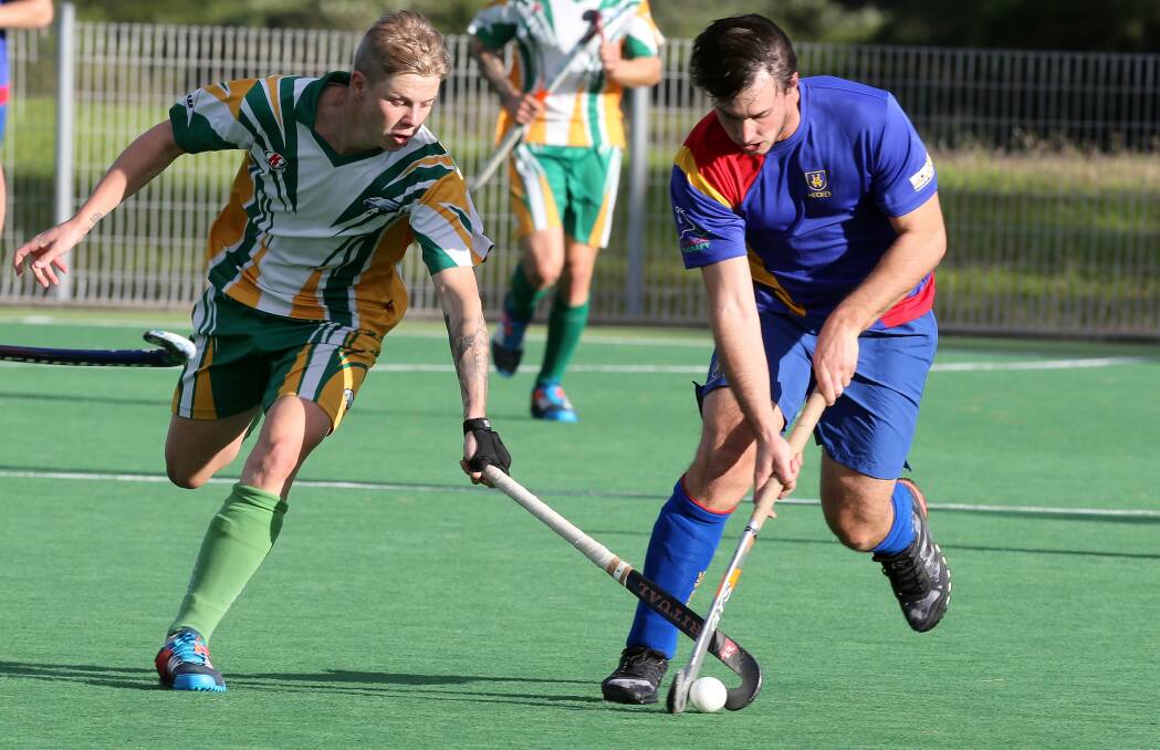 Albion Park player Brady Anderson and University's Corey Harding during Sunday's game. Picture: ROBERT PEET