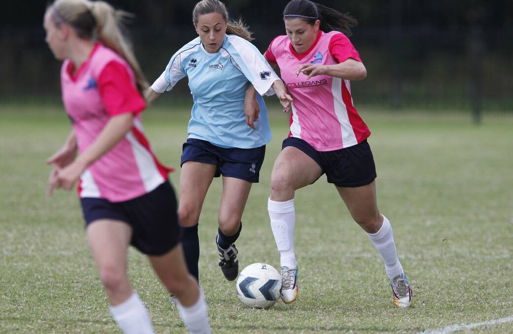 Stingrays' Talitha Kramer, right, goes toe-to-toe with Marconi's Evelyn Chronis at Collegians Sports Ground on Sunday. Picture: ANDY ZAKELI