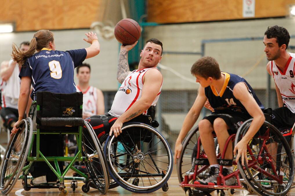 The Roller Hawks' Luke Pople looks for support against Sydney Uni Wheelings. Picture: CHRIS CHAN