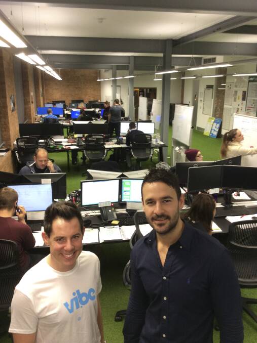 Luke Higgins, right, with team leader Nathan Vanderway at Vibe Teaching’s London headquarters. Set up by University of Wollongong graduates, the agency finds work for Australian teachers in London.