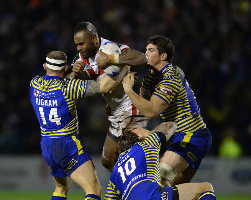 Winger Eto Nabuli drags in three Warrington defenders during St George Illawarra's 18-12 World Club Series win on Saturday morning. Picture: GETTY IMAGES