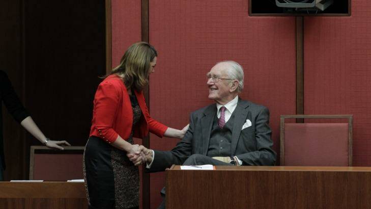 Senator Sarah Hanson-Young wither former Prime Minister Malcolm Fraser after she spoke against the Migration Amendment Bill in the Senate in August 2012.  Photo: Andrew Meares