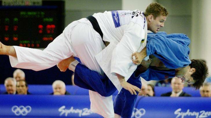 Olympic heritage: Dan Kelly puts his American opponent in a hold during their judo clash in the Sydney 2000 Olympics. Photo: Darren Pateman
