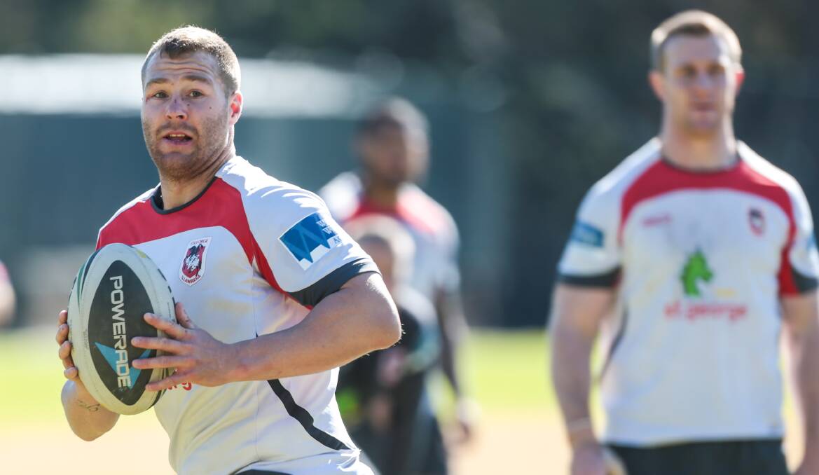 Trent Merrin runs the ball up during Dragons training at the University of Wollongong on Tuesday. Picture: ADAM McLEAN