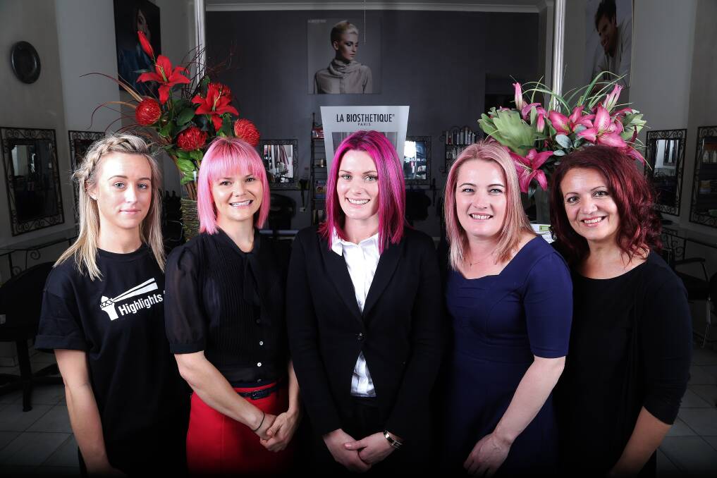 Doing their bit for mental health are Jessica Birkin, Emily Squires, Chantelle Drolc, Julie Van Meegen and Tomma Giorgio at Colours at Northbeach hair salon. Picture: GREG ELLIS