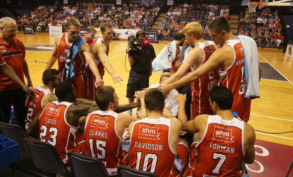 The Hawks talk tactics during their semi-final against Perth in Wollongong on March 30. Picture: ROBERT PEET