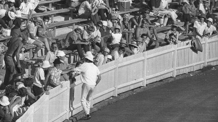 Englishman John Snow has an altercation with a spectator along the boundary fence at the SCG during an Ashes Test in 1971. Photo: John O'Gready
