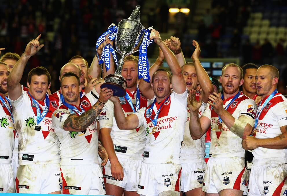 Ben Hornby holds up the Club Challenge trophy after victory over Wigan in 2011. Picture: GETTY IMAGES