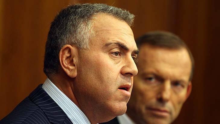 Treasurer Joe Hockey with Prime Minister Tony Abbott: The urgency of a budget deficit may be exaggerated, according to leading economists. Photo: Dominic Lorrimer