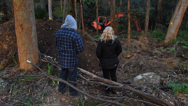 The parents of Matthew Leveson, Mark (left) and Faye (right) at the site in the Royal National Park at Waterfall. Photo: Kate Geraghty