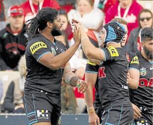 Men in black: Jamal Idris and Jamie Soward celebrate another try at WIN Stadium on Sunday. Picture: ANDY ZAKELI