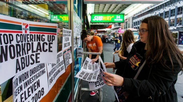 Protestors from the Young Workers Centre pin signs to the windows of 7-Eleven on the corner of Elizabeth and Flinders Street and protest about the company's worker exploitation and wage fraud scandal.  

Photograph Paul Jeffers
The Age NEWS
18 May 2016 Photo: Paul Jeffers