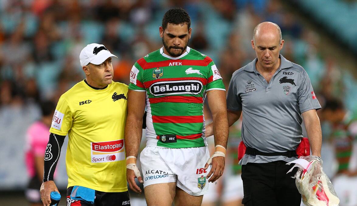 Superstar Rabbitohs fullback Greg Inglis leaves the field concussed during the match with Wests Tigers last year. Picture: GETTY IMAGES