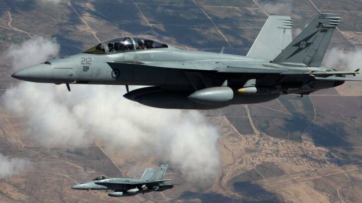 An Australian F/A-18F Super Hornet and an F/A-18A Hornet patrol the skies over Iraq.  Photo: Supplied