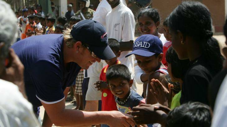 Shane Warne visited a tsunami refugee camp in southern Sri Lanka in 2005. Through his charity foundation, Warne donated money to the aid effort.  Photo: Andrew Taylor