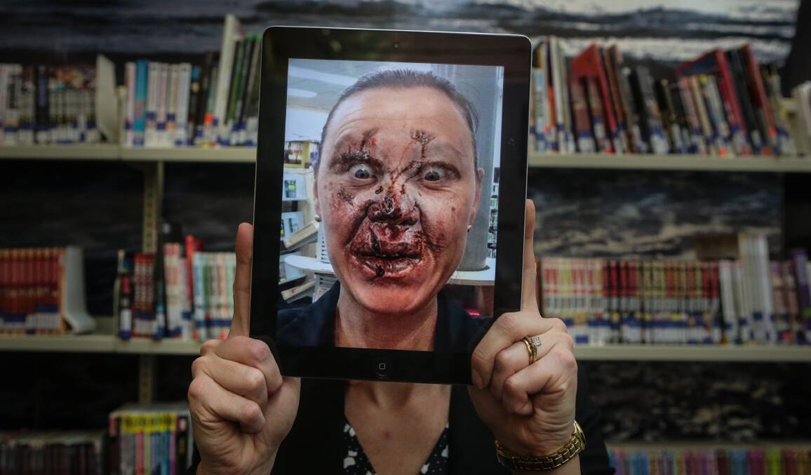 Undead face: Wollongong librarian Laura Gomes shows her zombie side for the upcoming school holiday library program. Picture: ADAM McLEAN