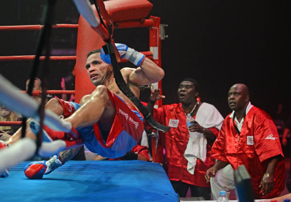 Anthony Mundine hits the canvas in Newcastle on Wednesday night. Picture: MARINA NEIL