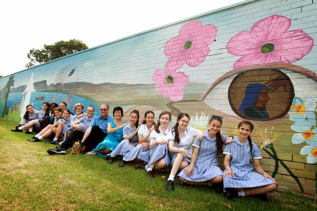 Students from St Mary's with their St Xavier Cathedral garage mural. Picture: SYLVIA LIBER
