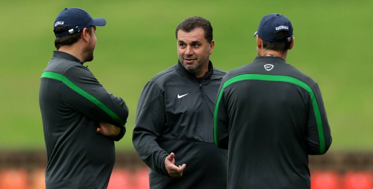 Ange Postecoglou (centre) with his coaching staff discussing tactics in preparation for Tuesday night's Asian Cup semi-final against the United Arab Emirates in Newcastle. Picture: JONATHAN CARROLL