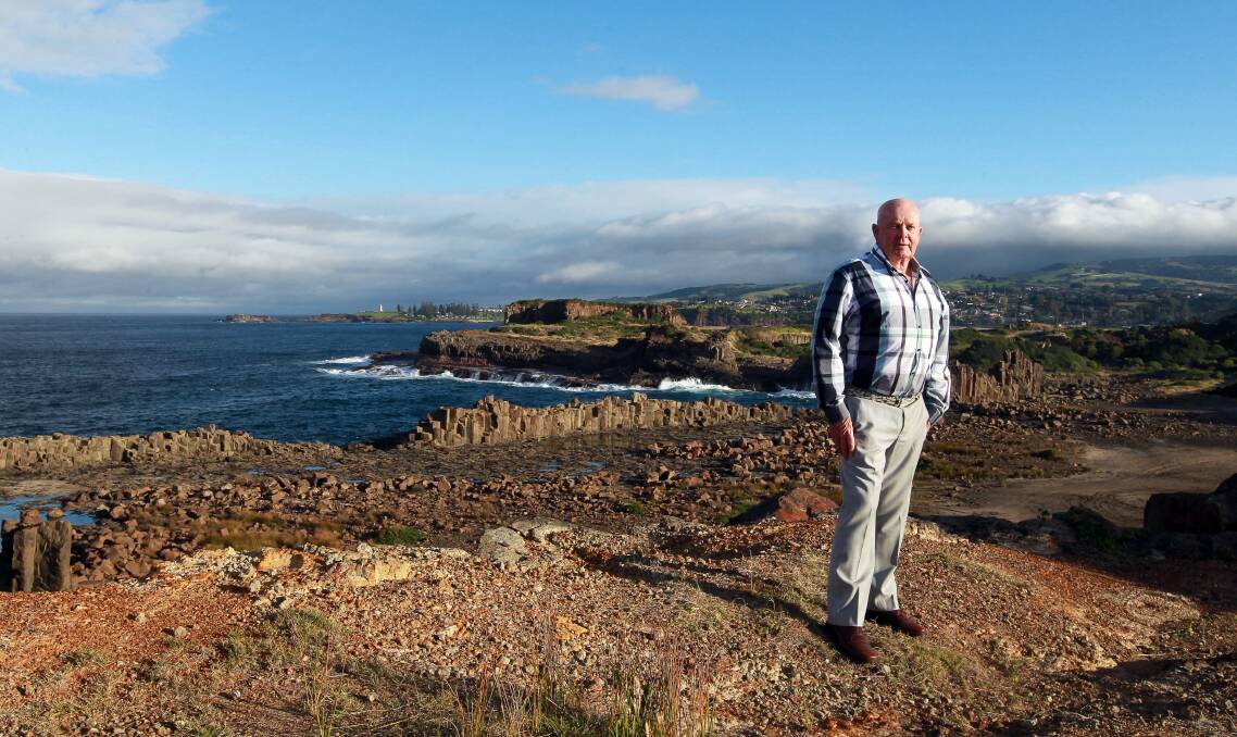 Planning under way: Cr Warren Steel stands overlooking Bombo quarry, which is a heritage-listed site.Picture: SYLVIA LIBER